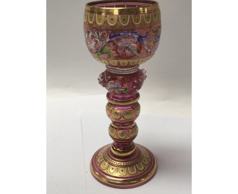 A Quality enamel and gilt decorated Venetian glass goblet with a knoped stem. Height 17.5cm