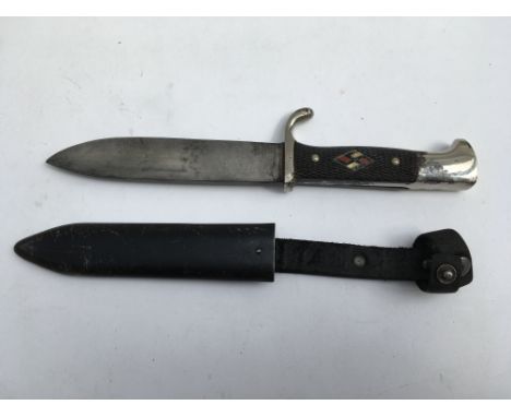 A Hitler Youth style knife bearing no marks. Blade length approx 14cm, total 24cm. Scabbard included.