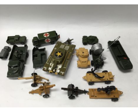 A Japanese tin plate toy tank together with other military toys including dinky