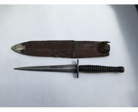 An unmarked dagger with a Sheffield leather scabbard. Blade length approx 17cm, 30cm overall.