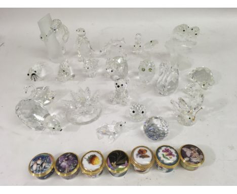 A collection of unboxed Swarovski animals figures and 7 Royal Worcester pill boxes