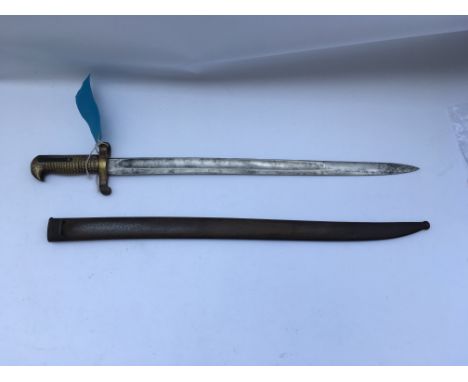 A large bayonet with a scale or feathered designed gilt, possibly American civil war. Blade length approx 50cm. Non conformin