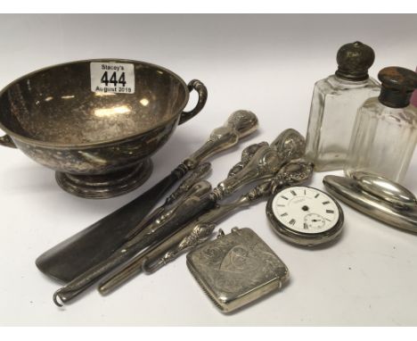 A collection of silver oddments a silver Vesta Case button hooks and a white metal bowl.
