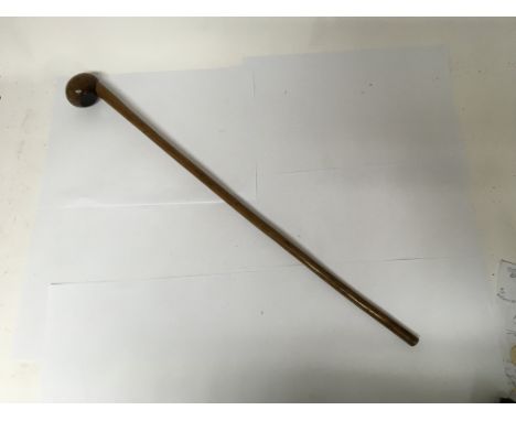 A Knobkerrie stick, possibly made of a Mohlware wood. Length approx 80cm.