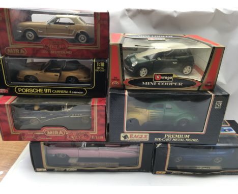Collection of boxed Diecast vehicles and three fishing rods