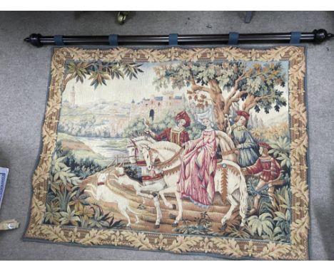 A tapestry depicting a noble hunting party on horseback, mounted on a pole. Size approx 120cm by 92cm.