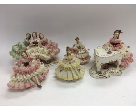 Five Dresden lacework figures of ladies and an Oriental tea service.