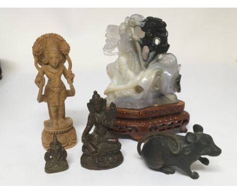 A carved coloured jade type stone and Indian bronzes and a carved wood figures.