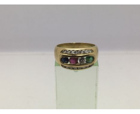 An 18ct gold cluster ring set with diamonds, emerald, sapphire and ruby, approx 6.7g and approx size N.