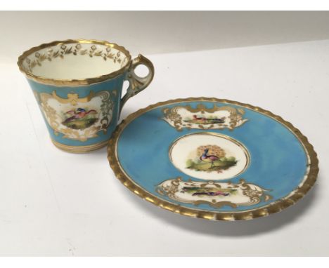 A Chamberlain &amp; Co Worcester hand painted and gilded cup and saucer with birds. Minor gilt rubbing no damage or restorati