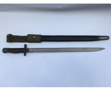 A British 1907 pattern bayonet with scabbard. Blade length approx 43cm, total 56cm.