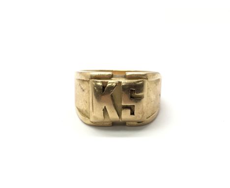 An unmarked gold ring with the letter K S embossed to the front, total weight approx 18.5 grams. Ring size N/O.