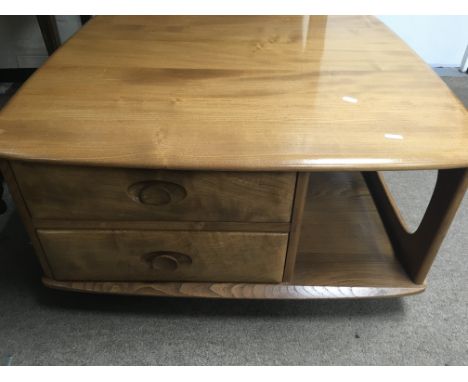 A Ercol  low occasion table of square form inset with two drawers