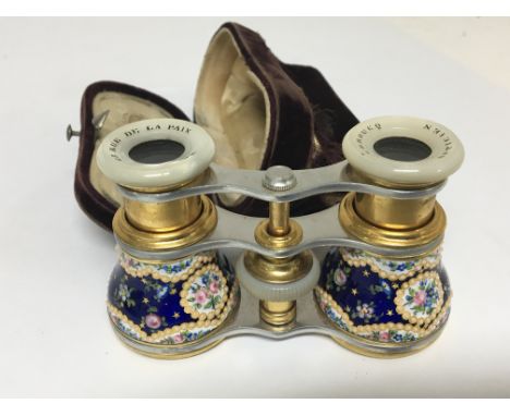 A Quality pair of French decorated enamel and gilded metal opera glasses.