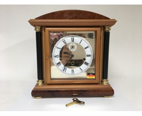 A German mantle clock by maker Hermle, with key. Height approx 34cm.