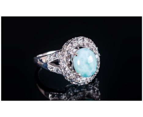 Larimar and White Topaz Ring, a 2.5ct cabochon of the pale sea blue gemstone, larimar, found only in the Dominican Republic, 