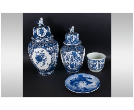 Four Pieces of Blue and White Delftware comprising large bulbous lidded vase in the Chinese style, 20 inches high, a similar 