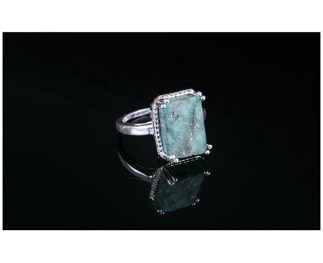 Natural Opaque Emerald Solitaire Ring, 6cts of the octagon cut natural emerald, set in silver; the emerald having been mined 