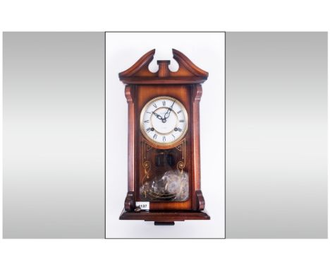 Severals 31 Day Wooden Cased Wall Clock, Porcelain dial with roman numerals. 21'' in height