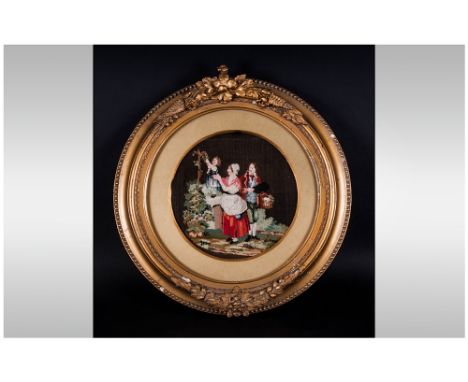 An Early 19th Century Tapestry Embroidery of rural folk depicting children in an ornate gilt frame. The tapestry measures 9 i