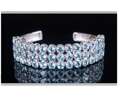 Sky Blue Topaz Three Row Bangle, 26cts of round cut sky blue topaz, reminiscent of aquamarine, set in three even rows to the 