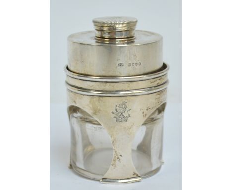 A Victorian hallmarked silver spirit warming travelling stove with squat cylindrical glass flask, crested with crown and lion