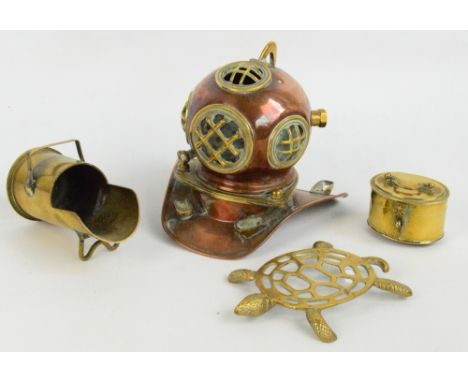 A copper and brass miniature diver's helmet, an oval brass box, a teapot stand modelled as a turtle, and a trench art miniatu