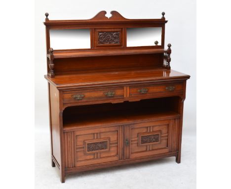 A late Victorian walnut sideboard, the raised back with two mirrors above a shelf and with base of two drawers above two cupb