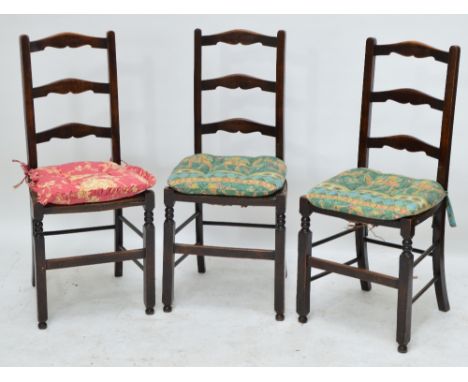 A set of three ladder back rush seated chairs (3).