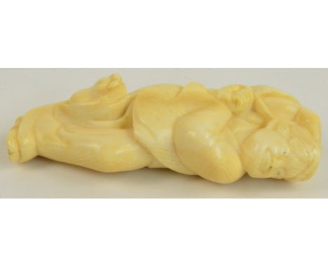 A Japanese Meiji period carved ivory netsuke modelled as a man in dancing/meditating pose, height 8cm.
