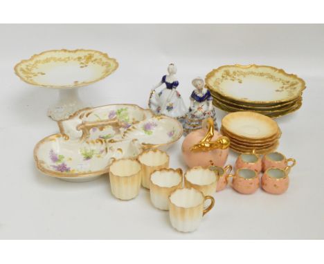 A quantity of Limoges ceramics including a dessert set of a tazza with four plates, with embossed gilt decoration to shaped r