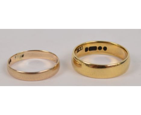 A 9ct yellow gold wedding band, size P and a further gold example size M, with inscription to the inside, approx 5.5g (2).