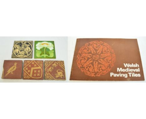 Three Welsh ceramic tiles; two depicting birds and one depicting coat of arms, 13 x 13cm, with book on Welsh Medieval Paving 