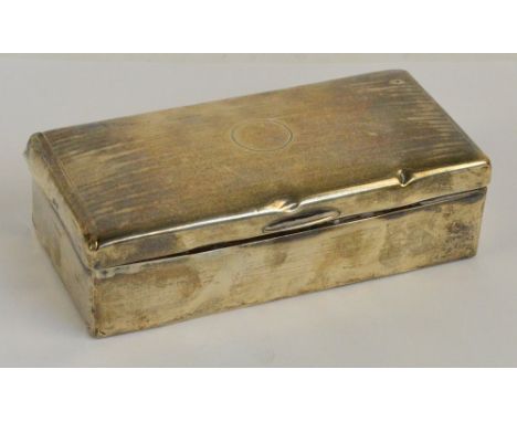 A George V hallmarked silver cigarette box of rectangular form centred with a circular vacant cartouche, engine turned decora