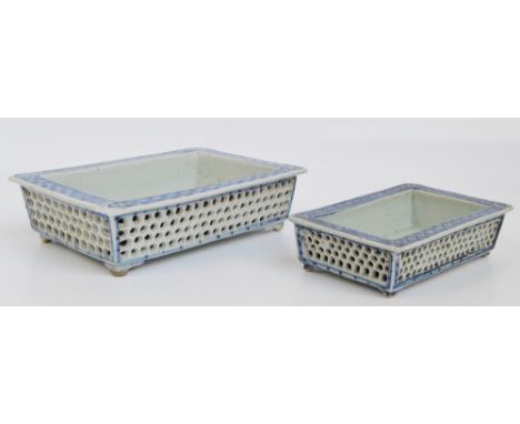 A 19th century Chinese blue and white porcelain double walled rectangular dish with pierced outer section with geometrical an