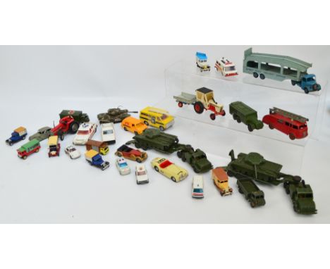 A collection of play worn diecast vehicles including Dinky tanks, tank carriers, army ambulance, armoured command vehicle, et