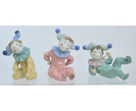 Three Nao figures of jesters in various poses (3).