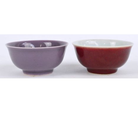 A late 19th/early 20th century purple monochrome glazed bowl, with Kangxi six character mark to base within double circle, an