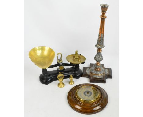 A set of vintage black lacquered Librasco kitchen scales, an oak wheel barometer and a large copper and electroplated candles