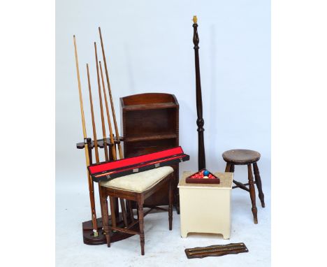 A rectangular upholstered piano stool with ring turned stretchered supports, a circular stool, a stool with hinged cork inset