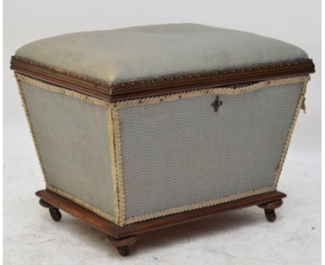 A Victorian mahogany small Ottoman stool, the hinged padded lid above tapering sides to mahogany frame to turned feet, width 