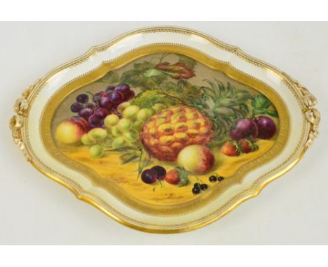 A Royal Worcester platter of shaped lozenge form hand painted with fruit within gilt border and gilt heightened ornaments, wi