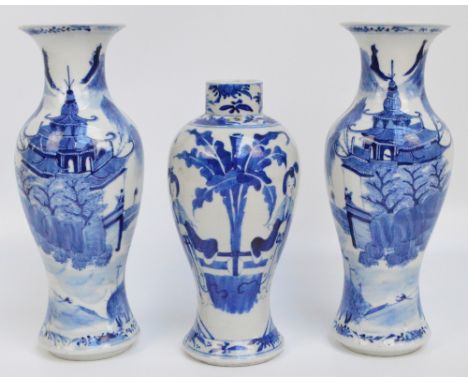 A pair of 19th century Chinese baluster vases, painted in underglaze blue with architectural landscape, height 30cm, and a fu