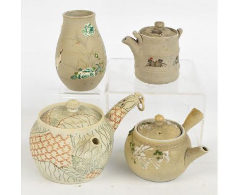 Four pieces of Japanese Banko ware comprising two medicine pots, the larger height 8cm, a baluster vase painted with cranes a