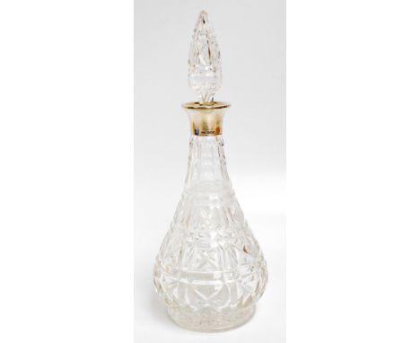A George VI hallmarked silver collared clear cut glass decanter of slender baluster form, James Dixon & Son, Sheffield 1937, 