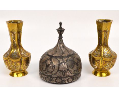 A pair of Eastern brass copper and silver overlaid vases of lobed baluster form, height 15cm, and an Indian Bidriware circula