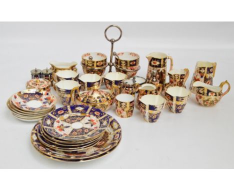 A large collection of Imari ware, mainly Davenport, including a part tea set; six plates, six cups and saucers, sucrier and j