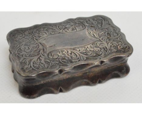 An Edward VII hallmarked silver shaped rectangular snuff box with bright cut foliate design and vacant cartouche in the shape