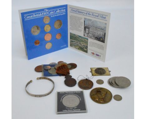 A small collection of coins including a set of Great British 1983 coins in uncirculated quality, some Elizabeth II commemorat