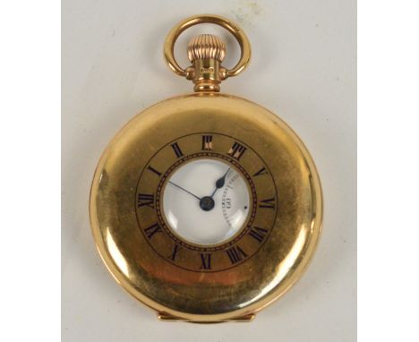 A 9ct yellow gold half hunter crown wind pocket watch, the circular dial and enamel chapter ring to cover set with Roman nume